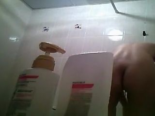 Hairy bush and small tits woman showering